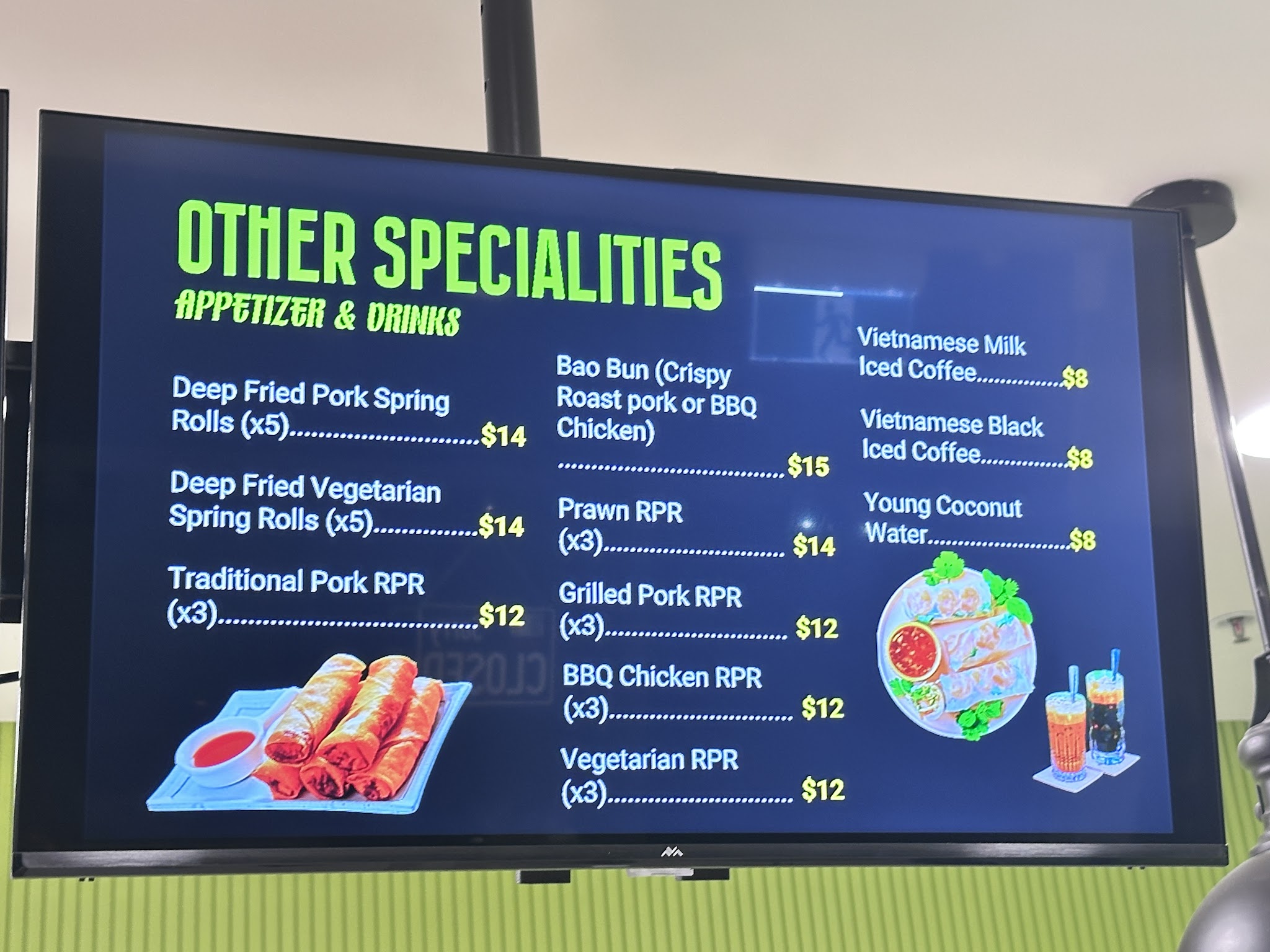 The Other Specialities menu screen in store, listing spring rolls, rice paper rolls, bao and drinks
