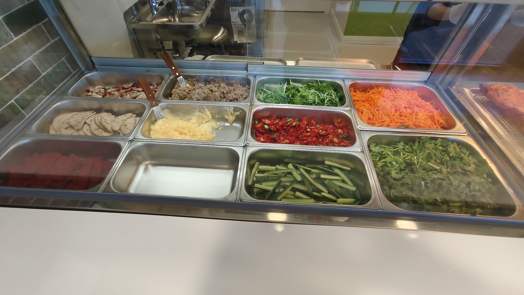 The fresh prep case: pâté, pickled daikon and carrot, chilli, coriander, cucumber and sliced pork